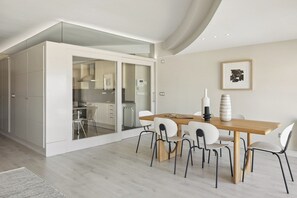 A modern kitchen with a glass door leading to a dining area. - Playa de la Concha 9 by FeelFree Rentals (San Sebastián)