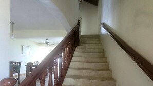 A staircase with wooden balusters and beige tiles. - Sage Mountain Skyway 3 (Road Town)