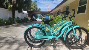A turquoise bicycle parked on a gravel path. - The Snapper, at Paradise Cove (Englewood)