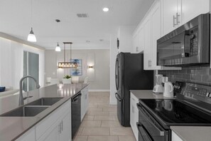 Coffee/tea maker, fridge, microwave, oven