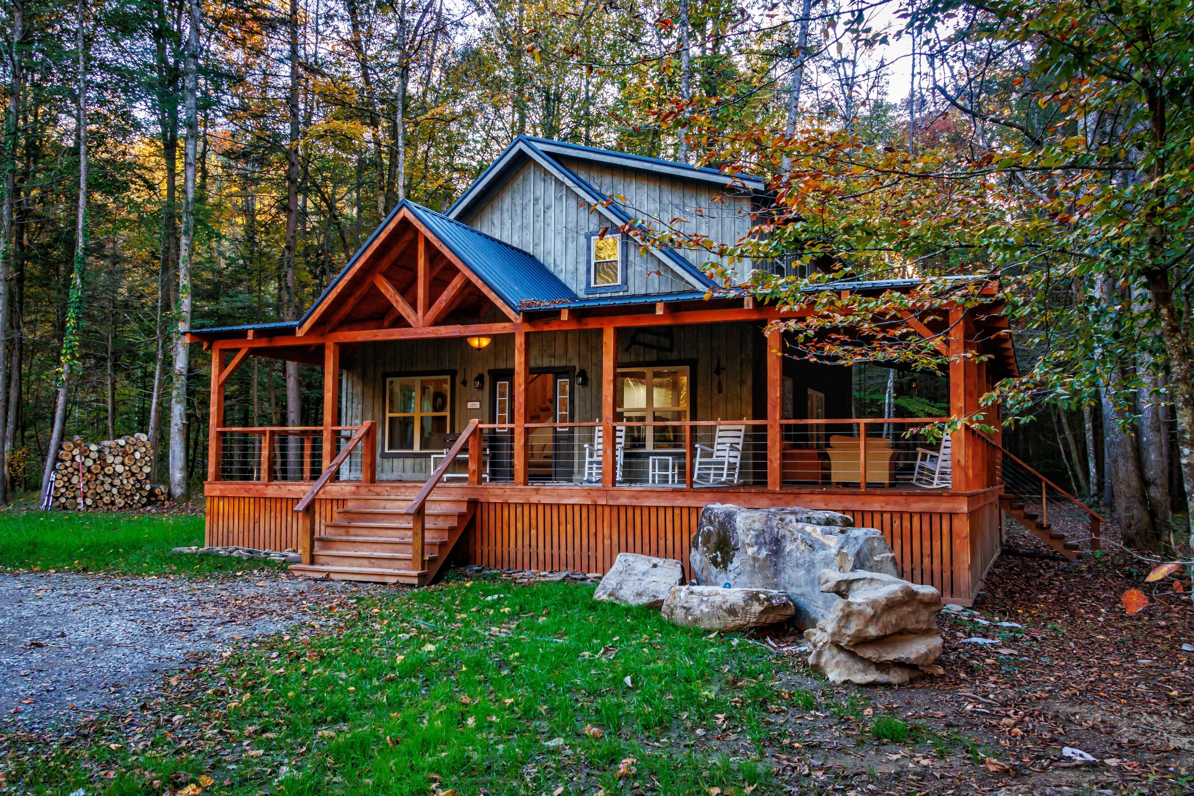 Secluded cabin beside private river, surrounded by peaceful nature 