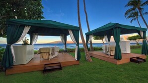 Two outdoor cabanas with ocean views, each with a bed and a small table. - OceanFrnt-1BDRm/1 BATH-Marriott Lahaina/NapiliTower Maui-Full Resort-Real Owner (Lahaina)