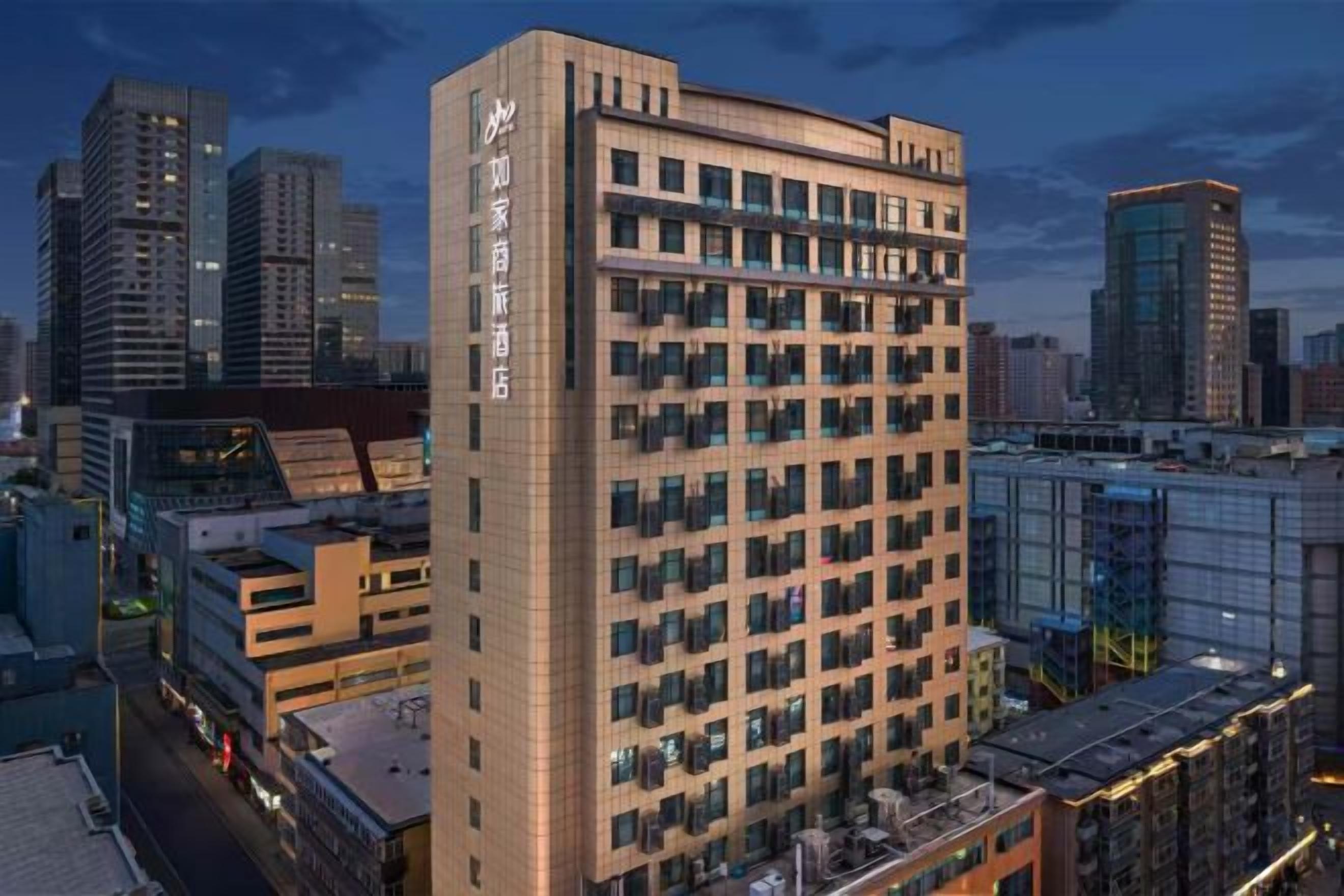 A high-rise hotel with multiple floors, large windows, and a modern architectural design.