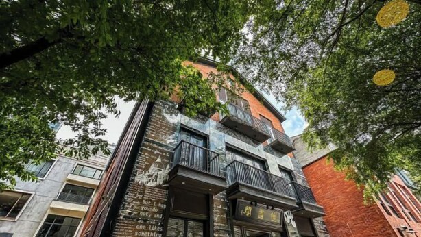 A multi-story building with a mix of brick and modern materials, featuring balconies and a visible entrance. - TOP TOURXiangtu·Wanyu (Tianzi Wharf, Beijing Road, Guangzhou) (Guangzhou)