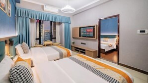 A hotel room with two beds, a TV, a city view, and a door leading to another room. - Angda Pazhou Apartment (Guangzhou Pazhou International Exhibition Center) (Guangzhou)