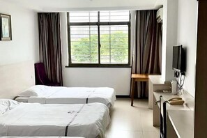 A hotel room with two beds, a desk, a chair, a TV, and a window with curtains. - Ruijun Laikehao Hotel Jingzhou (Jingzhou)
