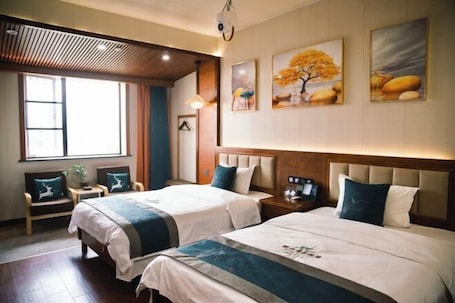 Habitación. Jinggu Xiaohong Hotel