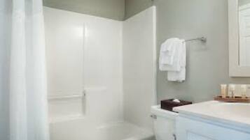 Jetted bath, hair dryer, towels, soap