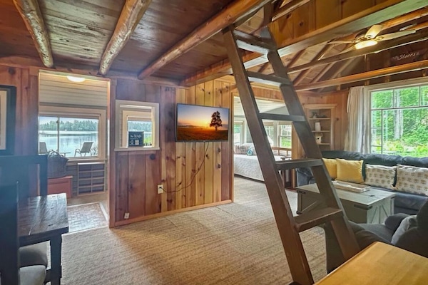 View of Sunroom from Living Room and ladder to Loft bedroom