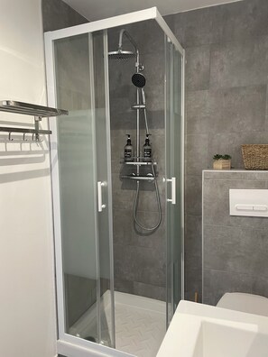 Shower, hair dryer, towels, soap
