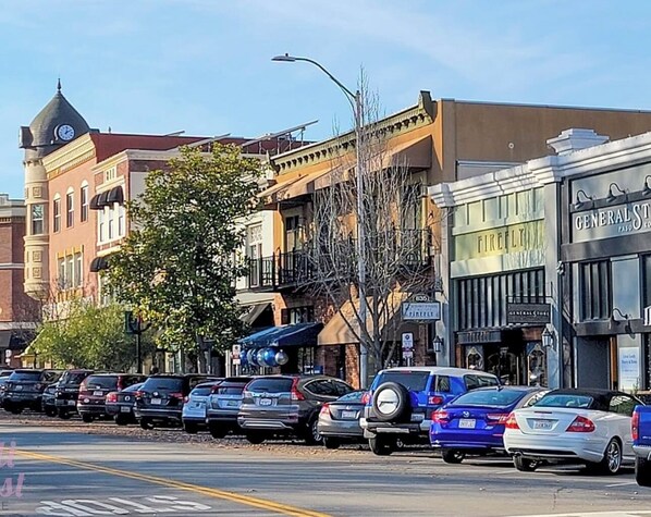 A street view with parked cars, buildings, and a clear sky. - Casa LoJo - a taste of old Paso in the heart of downtown. (Paso Robles)