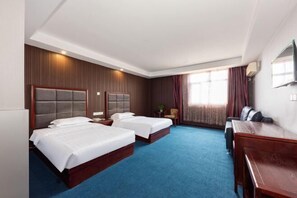 A hotel room with two beds, a desk, and a TV. - Hello Light Hotel (Wuhan Hankou North Road Branch) (Wuhan)
