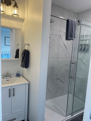Shower, hair dryer, towels, soap