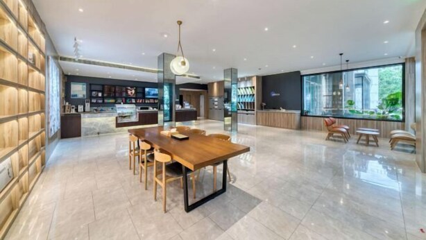 A spacious modern kitchen with a central island, built-in appliances, and a large window providing a view of the outdoors. - HanTing Hotel (Jiaxing Nanhu Yaohan Shopping Mall Area) (Jiaxing)
