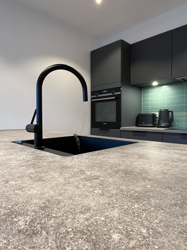 Apartment | Private kitchen | Full-size fridge, microwave, oven, stovetop - ATCON Downtown Apartments (Nuuk)