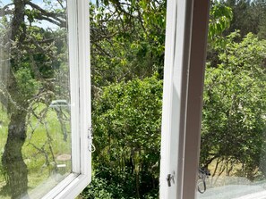 A window with a view of a tree and a road. - 4 Person Holiday Home in Asarum (Asarum)