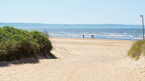 A sandy beach path leading to the ocean with a clear sky. - 4 Star Holiday Home in Skummeslovsstrand (Skummesloevsstrand)