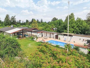 A residential property with a swimming pool, a covered patio, and a large garden area. - 5 Person Holiday Home in Frederiksvaerk (Frederiksvaerk)
