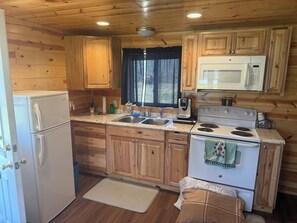 Fridge, microwave, oven, stovetop - Cozy Manistee Cabin • Walk to Udell Hills Trailhead • Near NCT & Manistee River (Manistee)