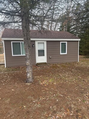 Exterior detail - Cozy Manistee Cabin • Walk to Udell Hills Trailhead • Near NCT & Manistee River (Manistee)