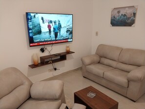 Living area - Charming 1-bedroom apartment with AC, WiFi in phenomenal Cairo Governorate (Madienty)