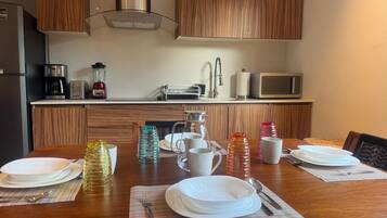 Fridge, microwave, stovetop, coffee/tea maker