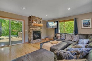Smart TV, fireplace, books, printers