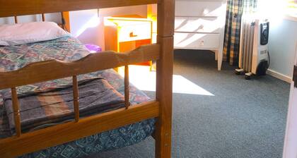 Cabin 9 has two separate rooms & sleeps 4. Guests have access to all amenities