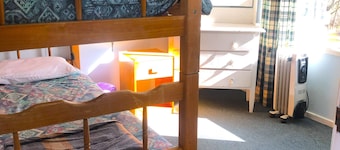 Cabin 9 has two separate rooms & sleeps 4. Guests have access to all amenities