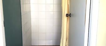 Cabin 9 has two separate rooms & sleeps 4. Guests have access to all amenities