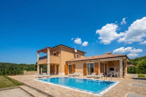 A two-story house with a swimming pool, outdoor seating, and a patio area. - 3BR Istrian Villa Erla w/ Private Pool, Labin, Croatia (Labin)