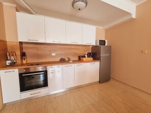 Departamento, 1 habitación | Cocina privada | Refrigerador, microondas, horno y parrilla de estufa
