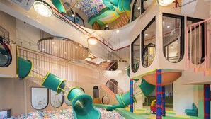 A multi-level indoor play area with slides and a ball pit. - Artel Shanwei - Xinghai Resort (Shanwei)