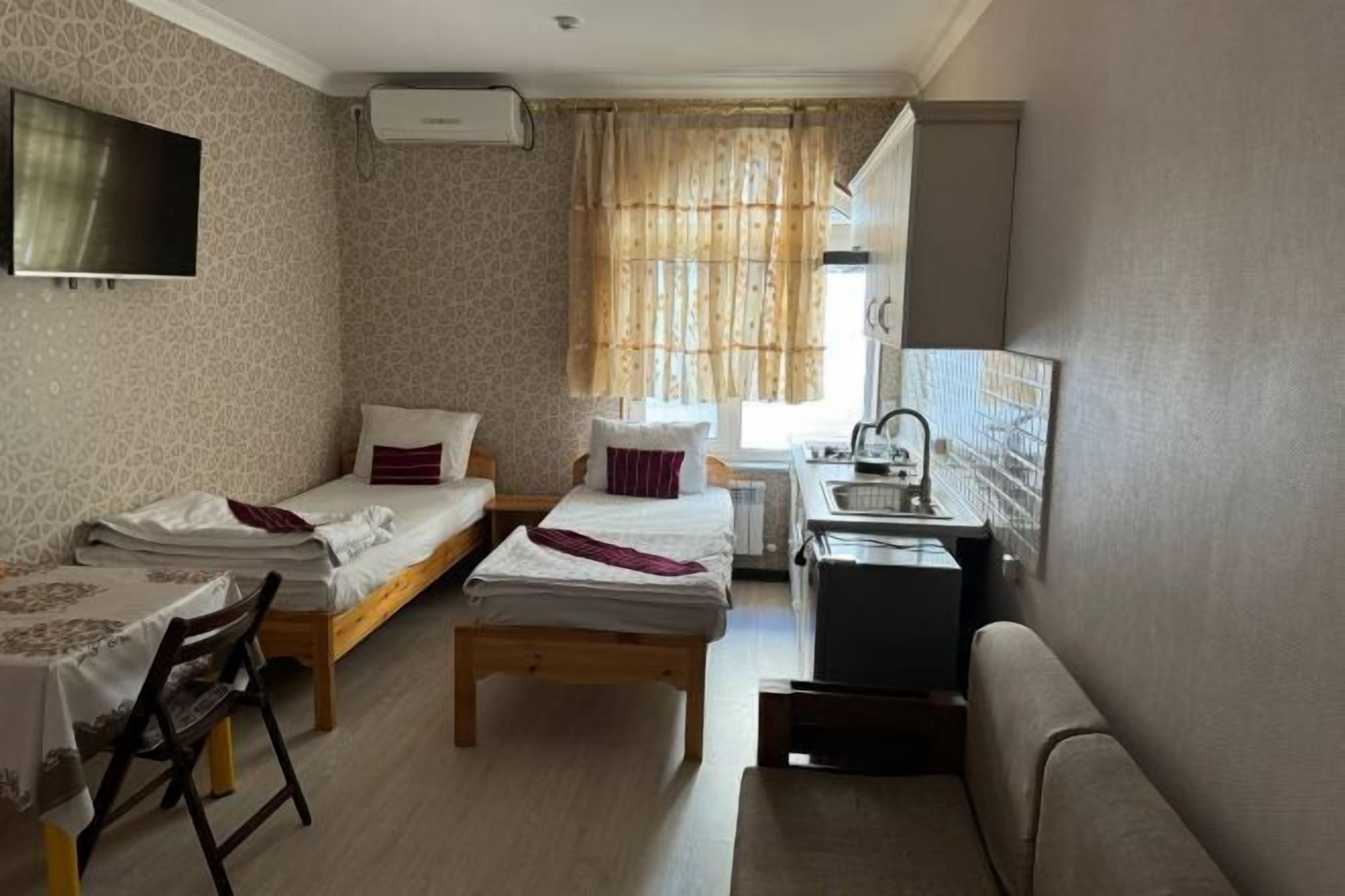 Premium bedding, desk, laptop workspace, soundproofing