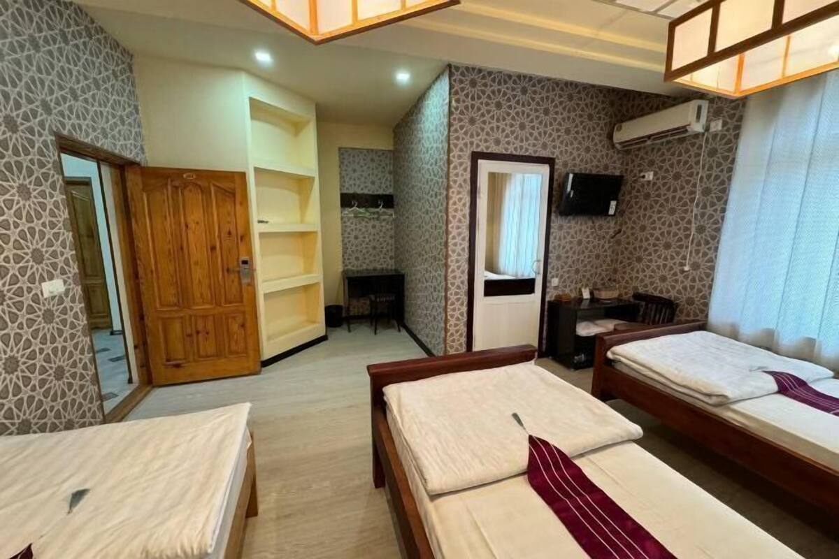 Premium bedding, desk, laptop workspace, soundproofing