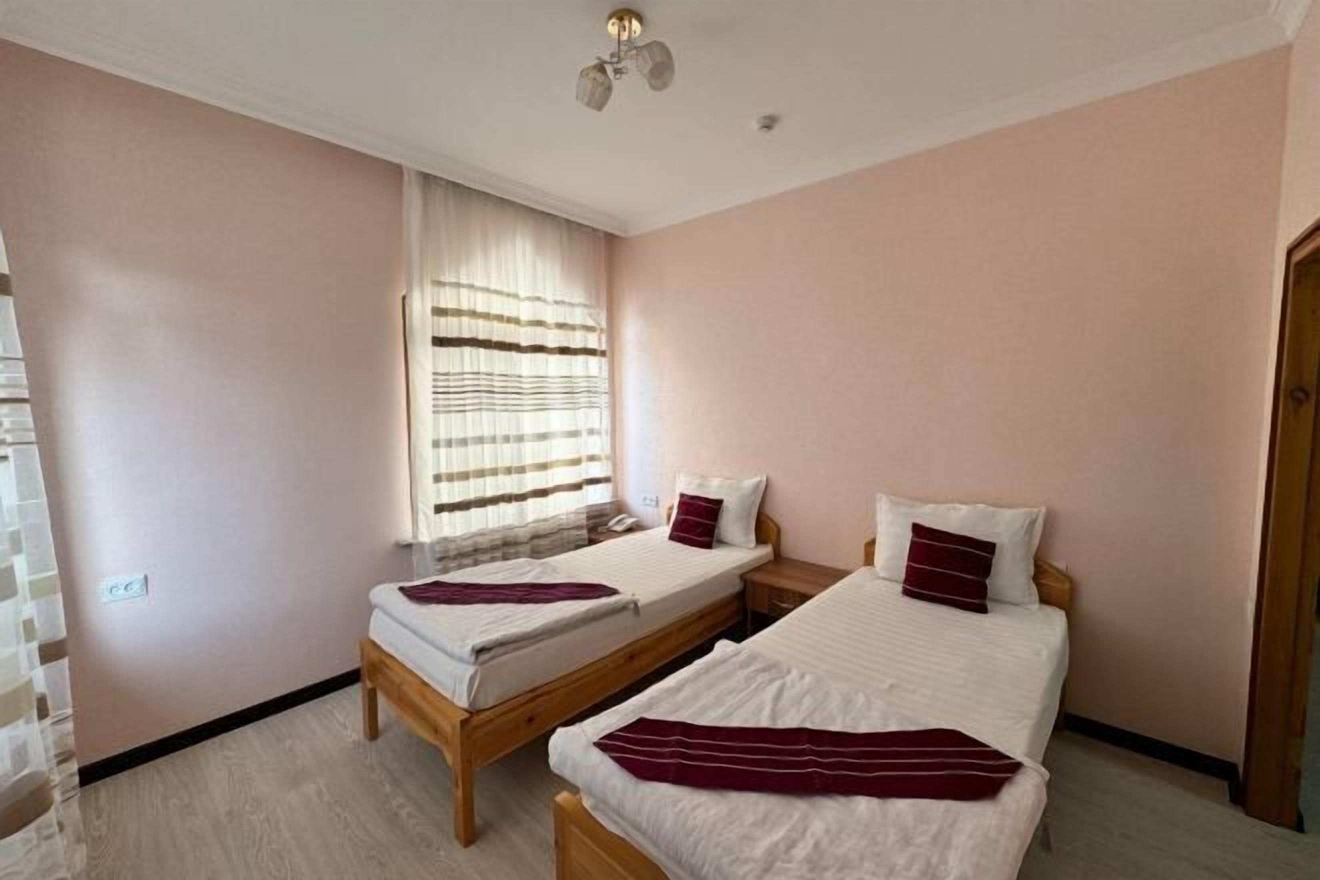 Premium bedding, desk, laptop workspace, soundproofing