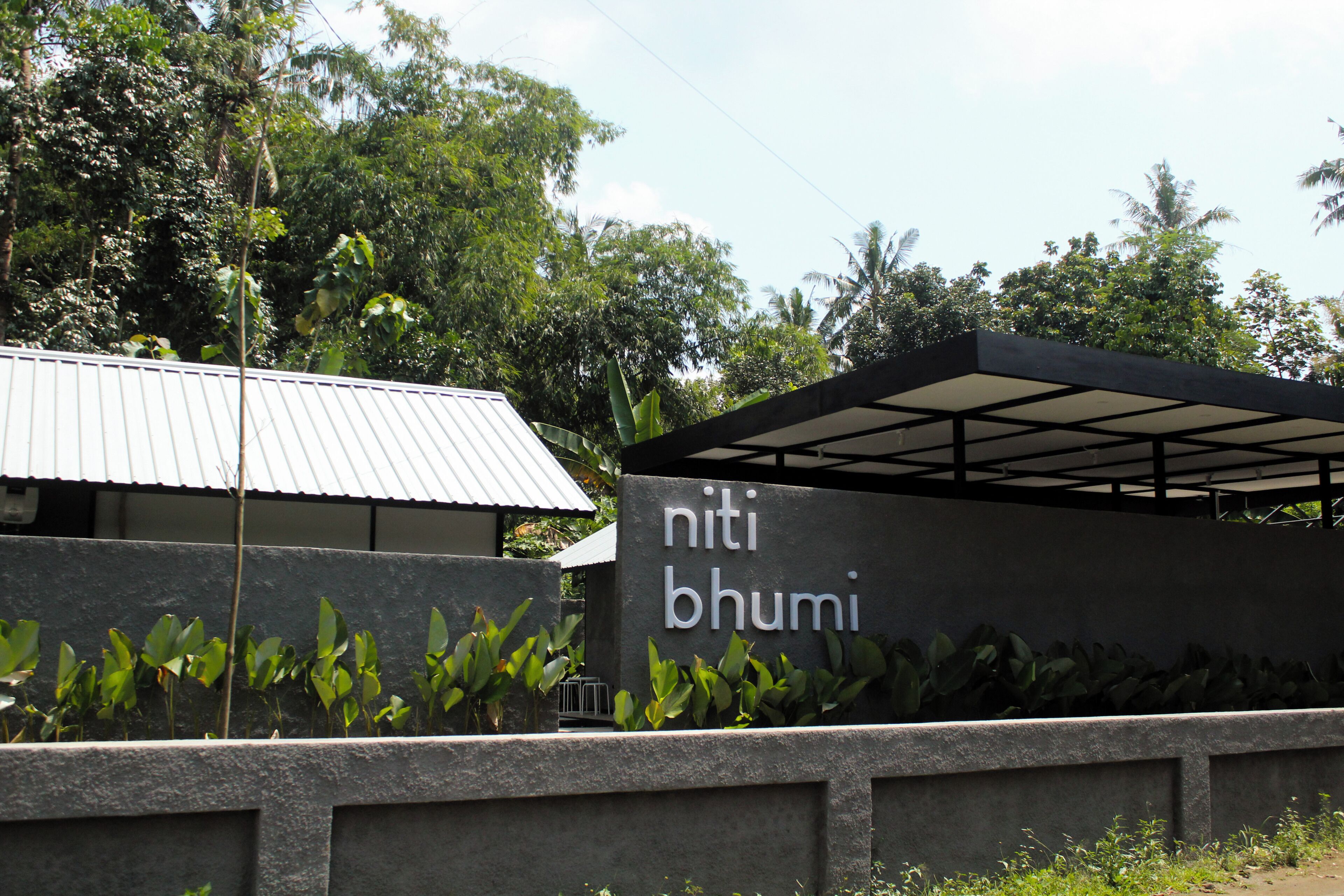 A building with a sign that reads "niti bhumi".