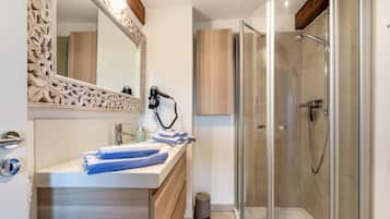 Shower, hair dryer, towels