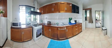 Deluxe Apartment, 3 Bedrooms, Pool Access, Executive Level | Private kitchen | Electric kettle, cleaning supplies