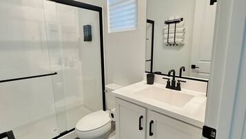 Shower, hair dryer, towels, soap