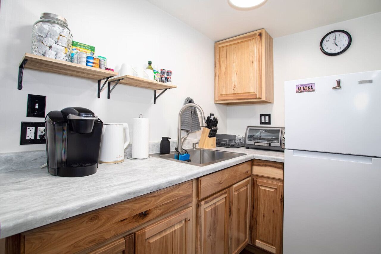 Fridge, coffee/tea maker, toaster, cookware/dishes/utensils