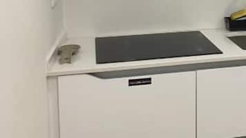 Stovetop, toaster, cookware/dishes/utensils, cleaning supplies