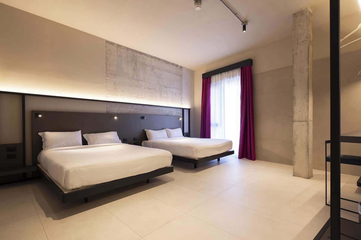Quadruple Room, Balcony | Minibar, in-room safe, desk, laptop workspace