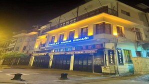 A building with multiple storefronts, including 'Fazilet Hanim Konagi' and 'Fistikci Vakkas'. - Fazilet Hanım Konağı (Gaziantep)