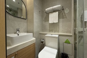 Shower, free toiletries, hair dryer, slippers