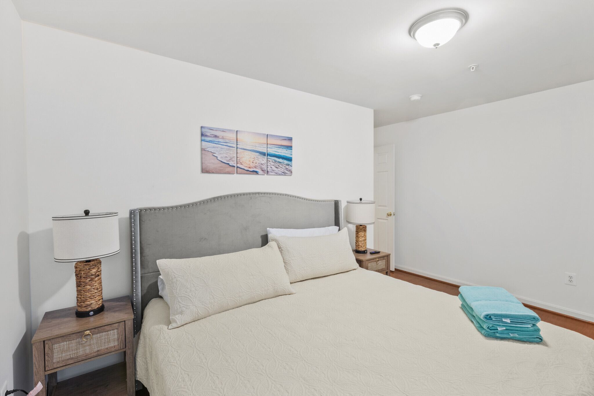 Primary bedroom with a king bed and TV