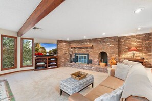 Smart TV, fireplace, table football, books