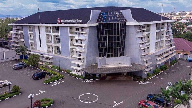 A multi-story hotel with a modern design, featuring a prominent glass facade and a flat roof. - Elegant Hotel by Best Western Plus  (Enugu)