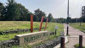 A sign for a nursery row in a park with a pathway and greenery. - Cosy London Apartment Near Borough Market (London)