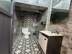 Shower, hair dryer, slippers, towels